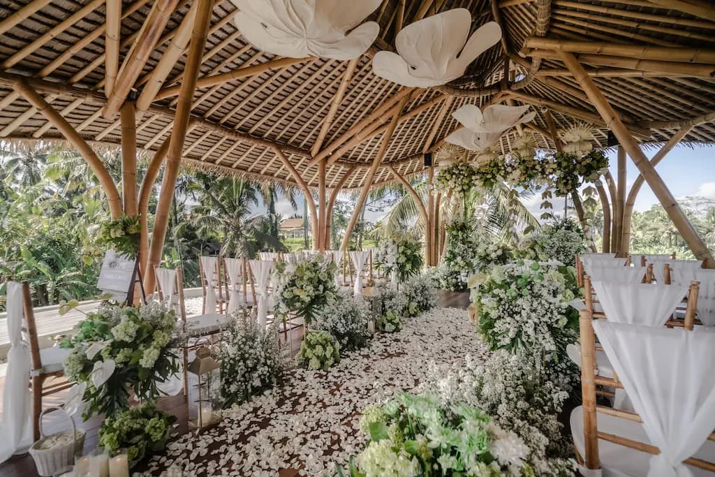 Floral-lined aisle under the spiraling bamboo roof